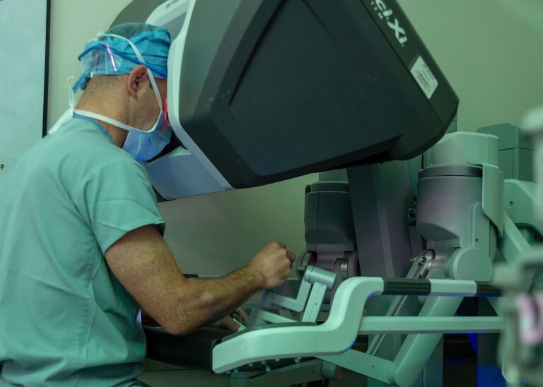 Surgeon performing robot-assisted surgery — medical illustration